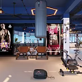 Modern Fitness Gym Interior With Spacious Layout Various Workout Equipment Windows And Pendant Lights