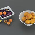 Fresh Ripe Plums and Apricots in White Bowls with Sliced Fruits
