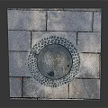 Road Facility Featuring Manhole Cover With Circular Design And Square Slabs Pavement