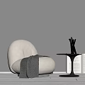 Beige Bean Bag Chair With Gray Blanket Side Table Metal Vase Open Book