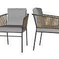 Stylish Dining Chairs with Rattan Armrests Black Metal Frames and Gray Cushions