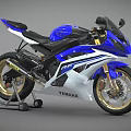 Yamaha R6 Sporty Motorcycle With Blue And White Body Gold Wheels And Black Seat