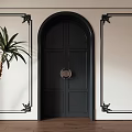 Black Double Doors With Circular Knocker Arched Frame Black Decorative Trim And Green Palm Plant