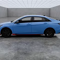 Blue Modern Sedan With Black Wheels And Red Trim In Indoor Showroom