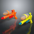 Orange And Yellow Toy Water Guns With Transparent Tanks And Colored Components