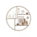 Elegant Gold Circular Metal Shelving Unit Displaying Decorative Vases Candles And Ornaments