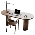Wooden Oval Desk with Laptop Mouse Table Lamp Headphones and Matching Chair Featuring Fluted Legs