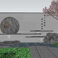Gray Garden Wall with Circular Stone Ornament Flowing Water Green Plants and Cherry Blossom Tree
