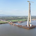 Massive Cable Stayed Bridge Under Construction With Tower Crane Spanning The Wide Calm River