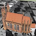 Historic Gothic Church With Red Brick Spires Crosses And Stained Glass Windows