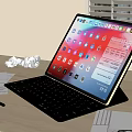 Tablet With Keyboard On Wooden Desk Displaying Apps For Productive Workspace With Office Supplies