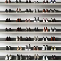 Different Types of Shoes Neatly Arranged on Multiple White Shelves