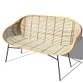 Modern Rattan Outdoor Chair With Curved Design And Black Metal Legs
