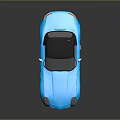 Shiny Blue Convertible Sports Car With Black Soft Top And Alloy Wheels
