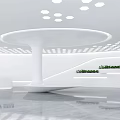 Modern Front Desk Reception Area With Circular White Desk Ceiling Lights And Green Plant Decor