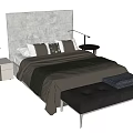 Modern Double Bed With Upholstered Headboard Textured Pillows Nightstand Lamp And Leather Ottoman