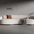 Beige Curved Sectional Sofa With Brown Pillow Gray Blanket In Designer Room And Green Plant