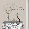 Decorative Ornament Combination With Glass Vase Twigs Table Lamp Books On Marble Table