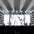 Fashion Runway Show with Bright Stage Lights Large Screen Models Live Band and Audience