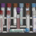 Medical Device Test Tubes With Various Colored Caps In Metal Rack And Labels