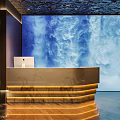 Elegant Hotel Lobby Featuring Large Blue Waterfall Painting Illuminated Reception Desk Computer And Wooden Floor