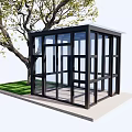 Modern Glass Pavilion Structure With Black Frame Near Green Tree And Grass Area