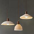 Three Modern Minimalist Pendant Lights With Beige White Fabric Shades Brown Rods On Grey Background