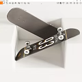 Stylish Black Skateboard With White Logo Gold Accents Metal Trucks And White Wheels
