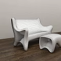 Modern Public Chair Featuring White Sleek Surface And Pink Patterned Accents With Matching Ottoman