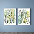 Watercolor Plant Paintings With Green Leaves In White Frames On Light Blue Wall