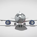 Silver Colored Commercial Airplane With Blue Engines