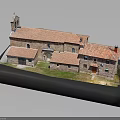 Architectural Model Of Courtyard Style Building With Red Tiled Roofs And Brick Structure