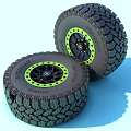 Off Road Tires With Deep Tread Black Rims And Green Accent Rings
