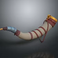 Horn Shaped Decorative Household Item With Yellow Top Brown Straps And Blue Section