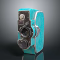 Vintage Turquoise Electronic Camera With Metal Frame And Retro Design Details