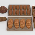 Assorted Fresh Breads Display With Croissants Baguettes And Round Loaves On Wooden Trays