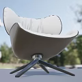 Modern Leisure Chair With Beige Leather Upholstery Curved Backrest And Swivel Base