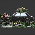 Black Paper Craft Car With Flowers On Roof Inside And Green Leaves Decoration