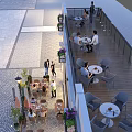 Outdoor Restaurant Terrace With Tables Chairs Dining Customers Plants And Stone Pavement