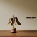 Wooden Base Table Lamp with Beige Fabric Shade on Wooden Table and Warm Light