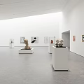 Bright Spacious Art Gallery With White Pedestals Sculptures And Wall Paintings