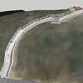 Scenic Winding Pedestrian Walkway With Safety Railings And Wooden Decking On Sloped Terrain
