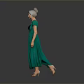 Woman In Green Deep V Neck Dress With Updo Hairstyle Walking On Gray Background