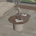 Beige Sofa With Two Round Coffee Tables Wooden Tabletop White Cylindrical Base And Magazines