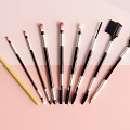 Professional Makeup Brushes With Various Colors And Sleek Handles On Pastel Background