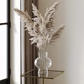 Clear Glass Vase With Dried Pampas Grass On Gold Metal Table By Window