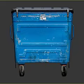 Blue Wheeled Trash Bin With Lid And Worn Exterior Details