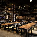 Industrial Bar Interior With Long Wooden Tables Hanging Chandeliers And Seating