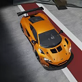 Orange Sports Car With Rear Wing And Aerodynamic Front Design On Track Surface