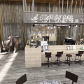 Modern Restaurant Interior With Wooden Accents Pendant Chandeliers Open Space And Outdoor Green Umbrellas